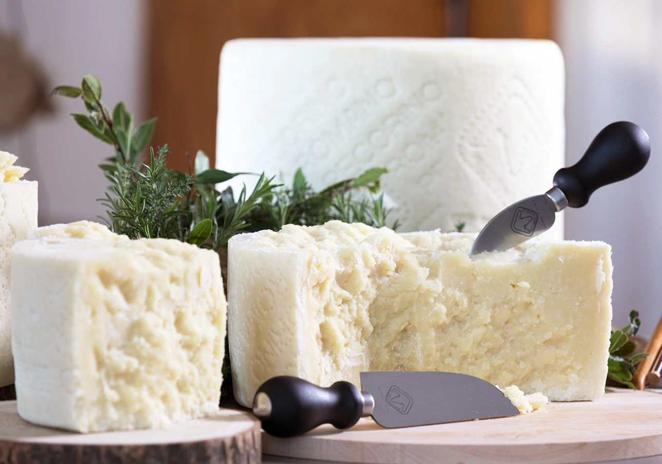 Wheels of Italian Pecorino Romano cheese, broken up into large pieces // Photo by Consorzio per la tutela de Pecorino Romano // FoodNouveau.com