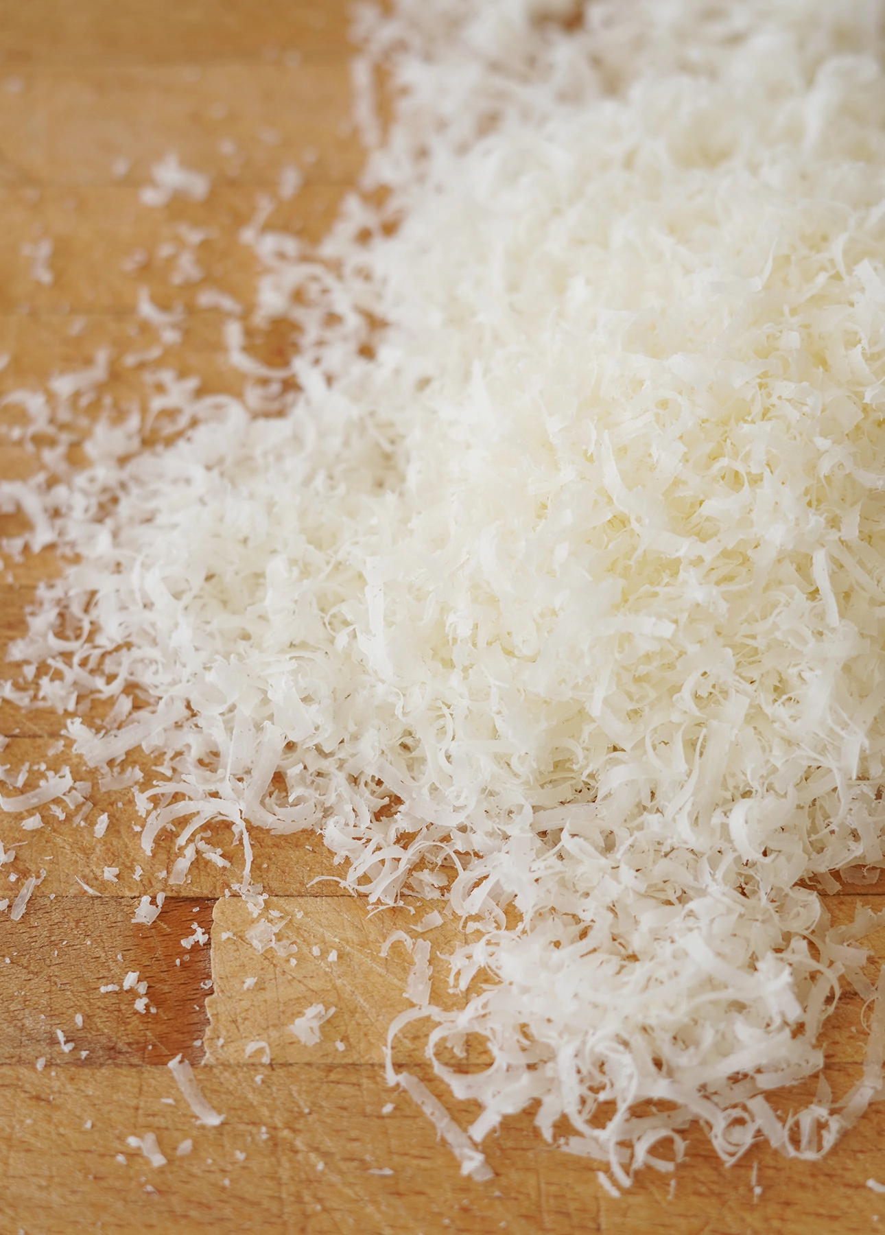 Very finely grated Pecorino Romano cheese, which will be used to make Cacio e Pepe pasta // FoodNouveau.com